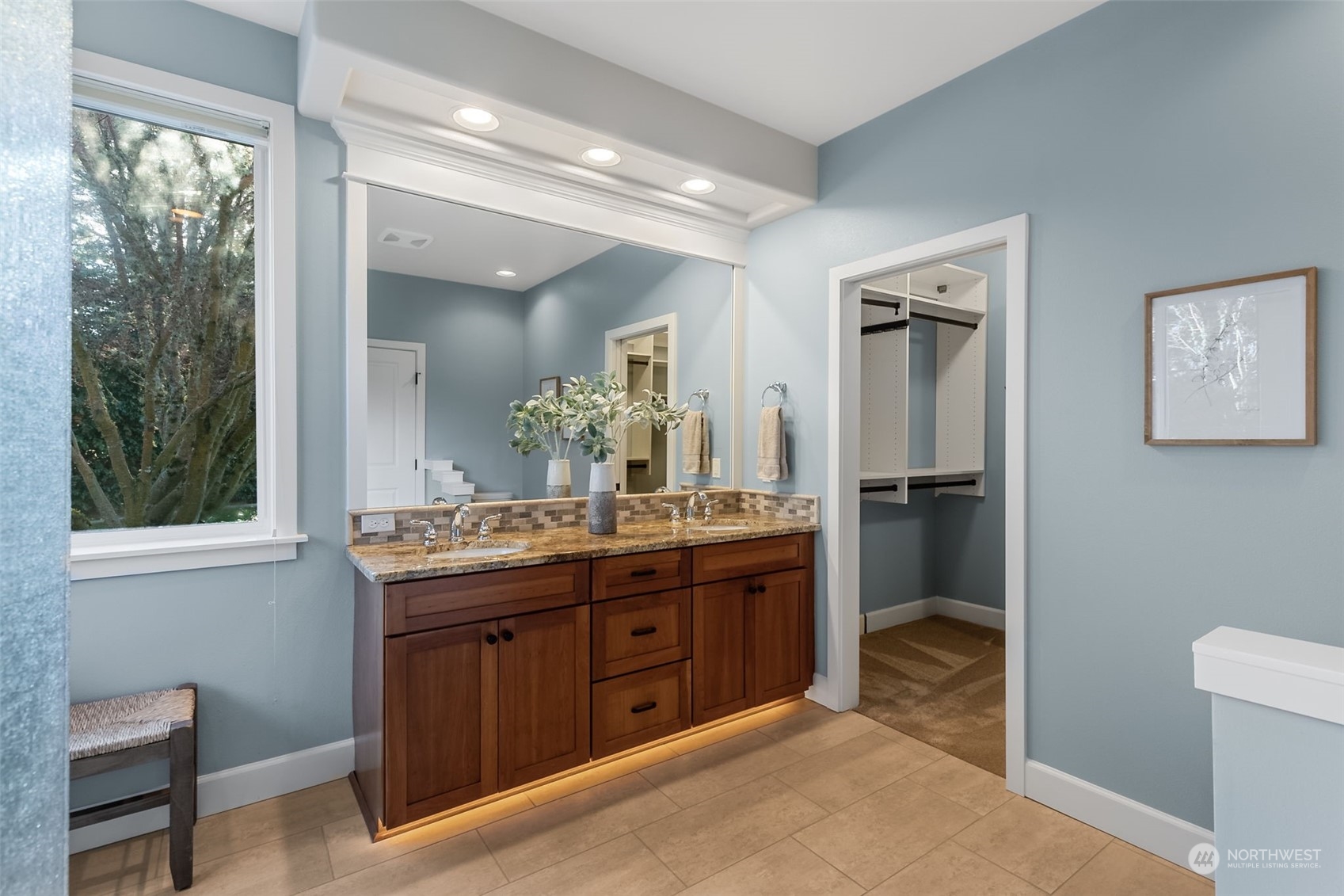 9306 Milburn Loop Southeast Olympia, WA 98513 - Photo 20 of 40 a spacious bathroom with a granite countertop sink a mirror and a shower