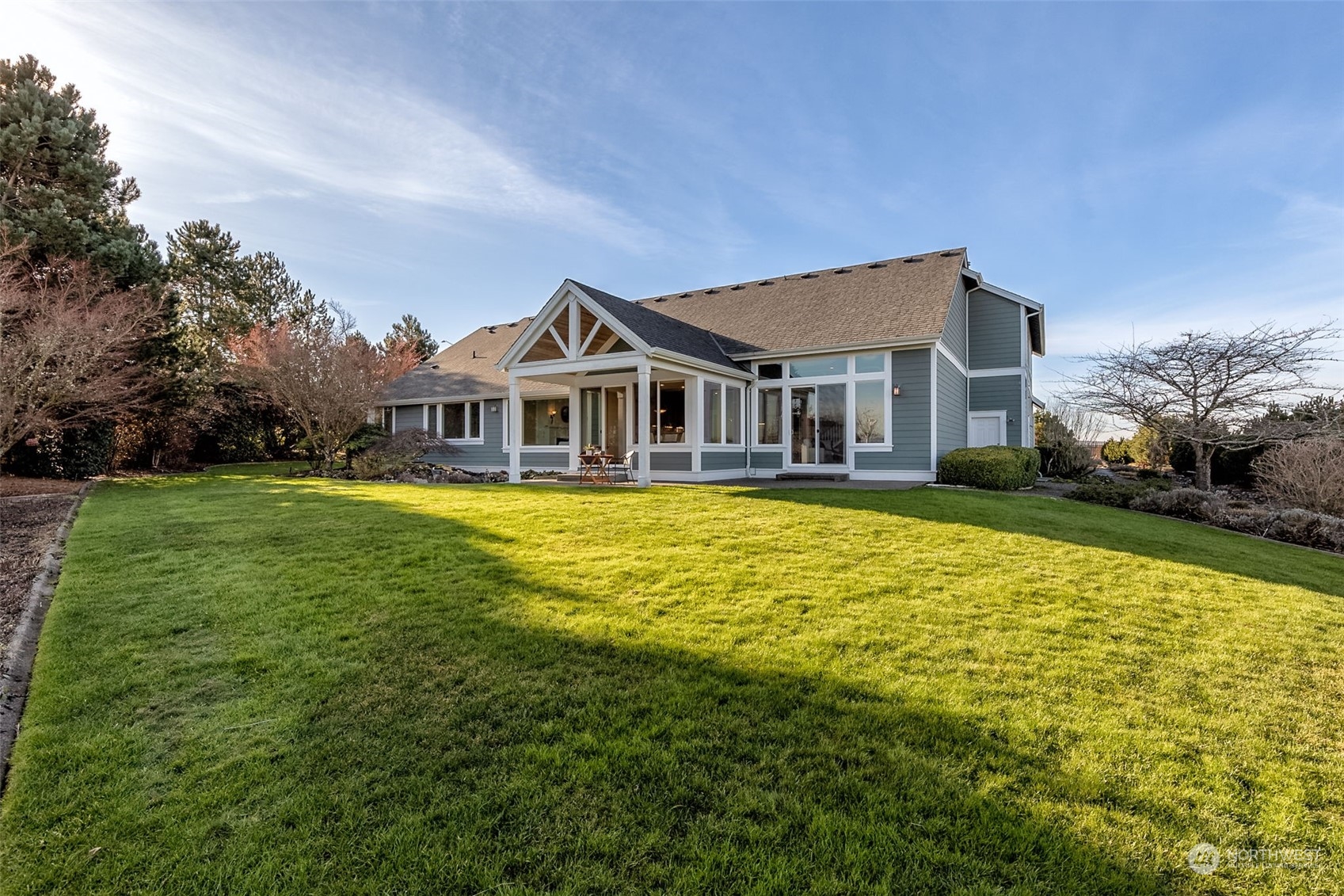 9306 Milburn Loop Southeast Olympia, WA 98513 - Photo 30 of 40 a front view of a house with a yard table and chairs