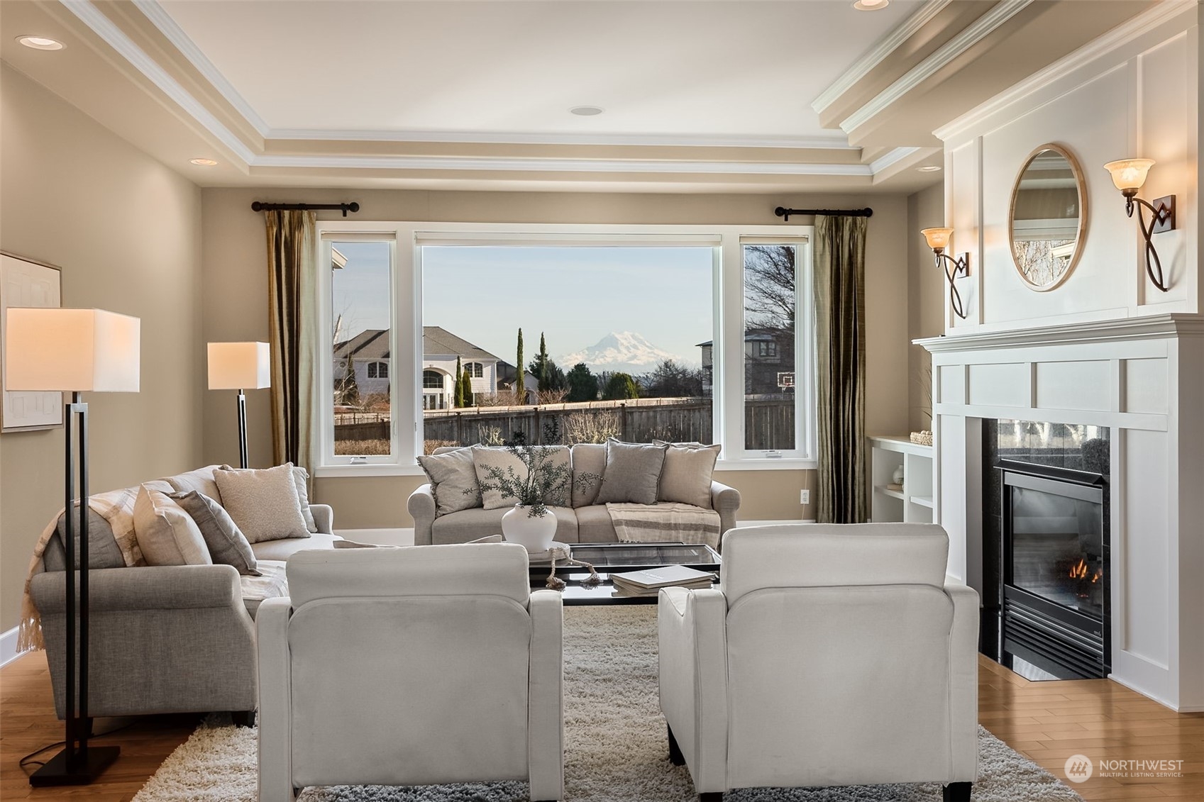 9306 Milburn Loop Southeast Olympia, WA 98513 - Photo 3 of 40 a living room with furniture and a floor to ceiling window