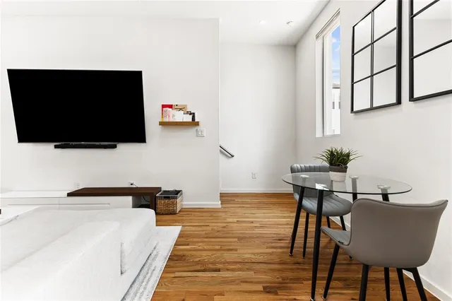 a view of a livingroom with furniture and a flat screen tv