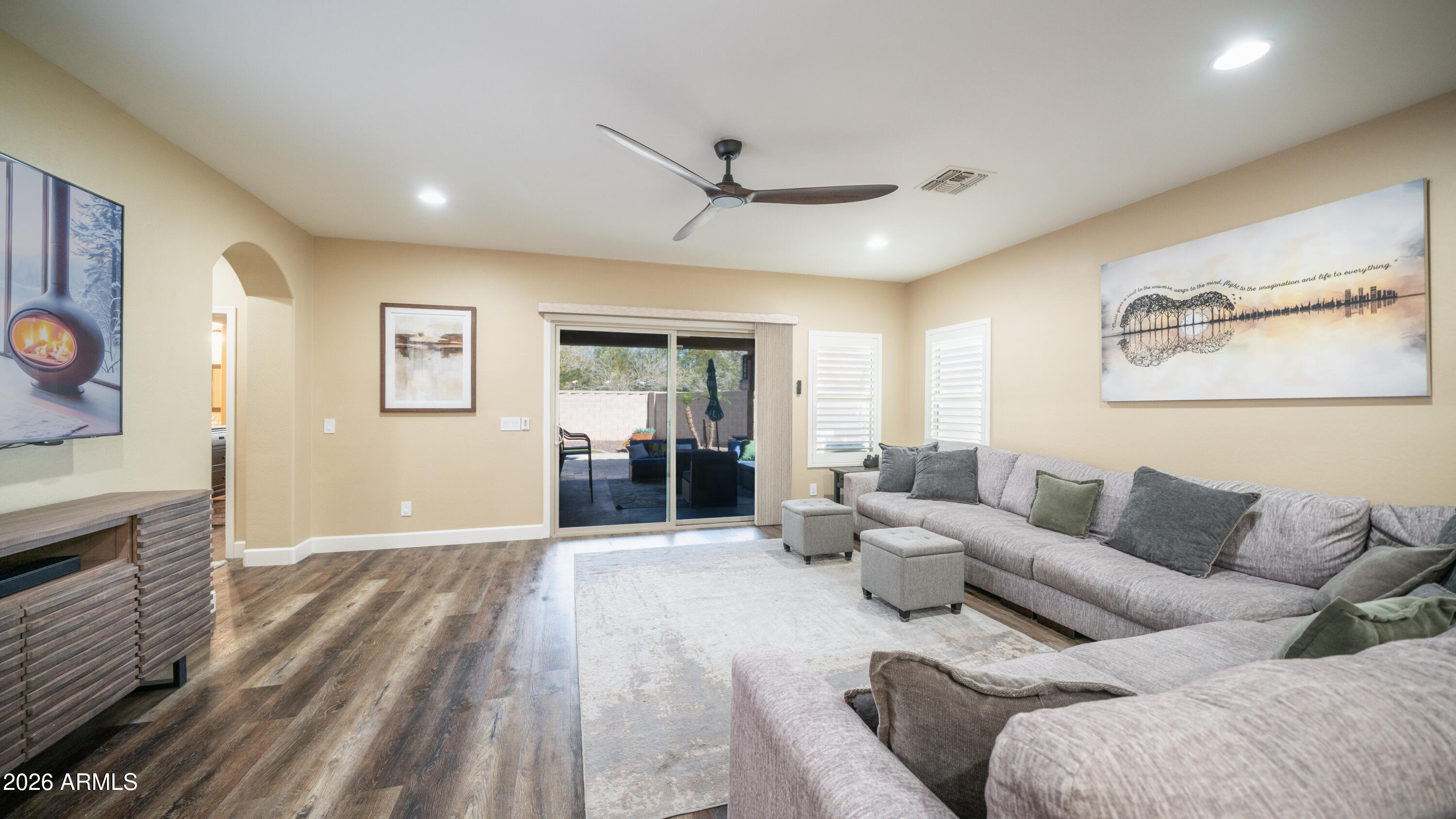 10754 West Yearling Road Peoria, AZ 85383 - Photo 13 of 35 a living room with furniture and wooden floor