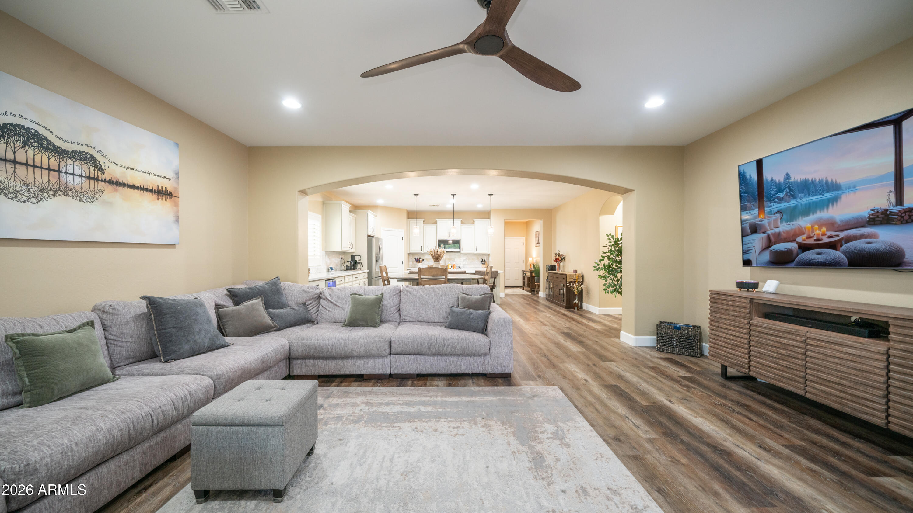 10754 West Yearling Road Peoria, AZ 85383 - Photo 15 of 35 a living room with furniture and a chandelier