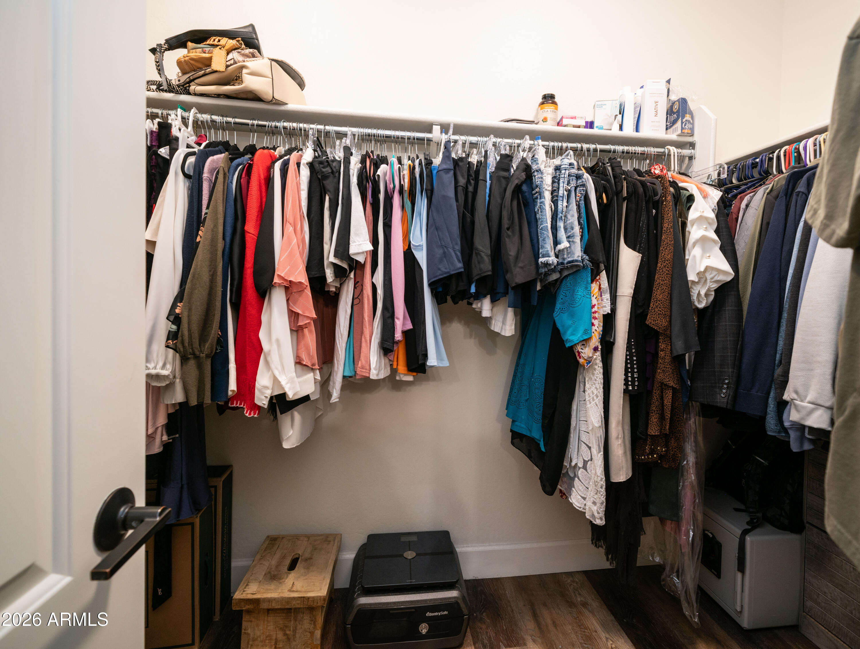 10754 West Yearling Road Peoria, AZ 85383 - Photo 21 of 35 a view of walk in closet with clothes and shoes