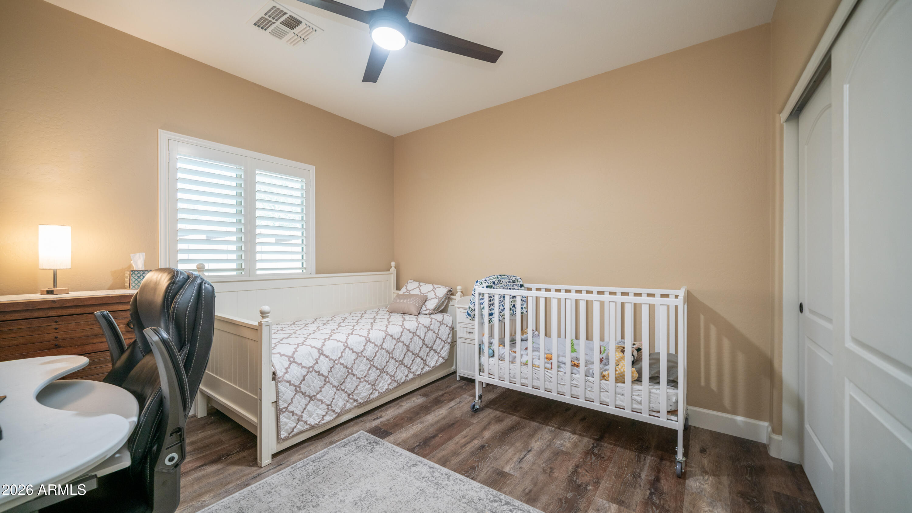 10754 West Yearling Road Peoria, AZ 85383 - Photo 23 of 35 a bedroom with a bed and a desk