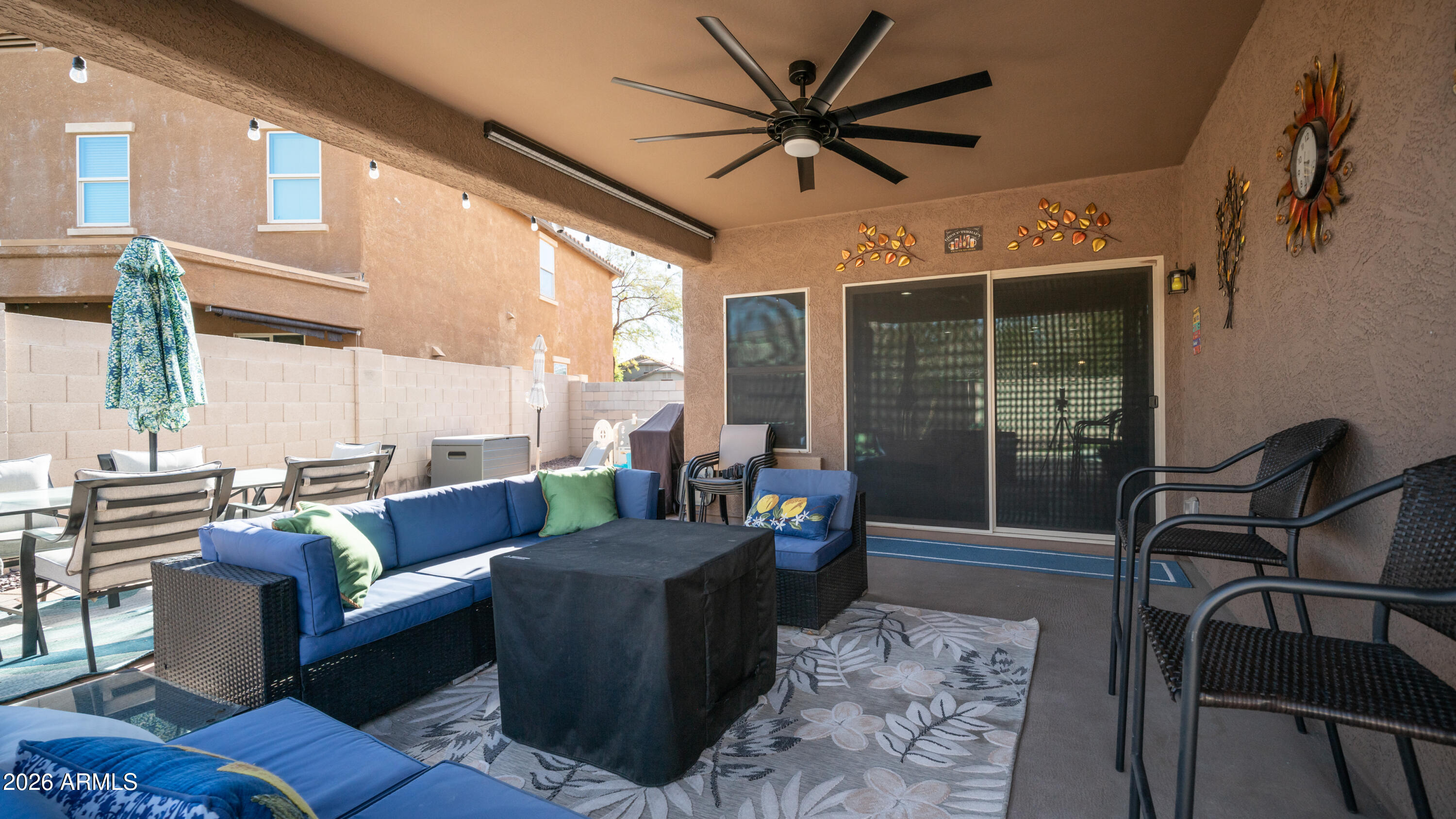 10754 West Yearling Road Peoria, AZ 85383 - Photo 29 of 35 a living room with furniture and a large window