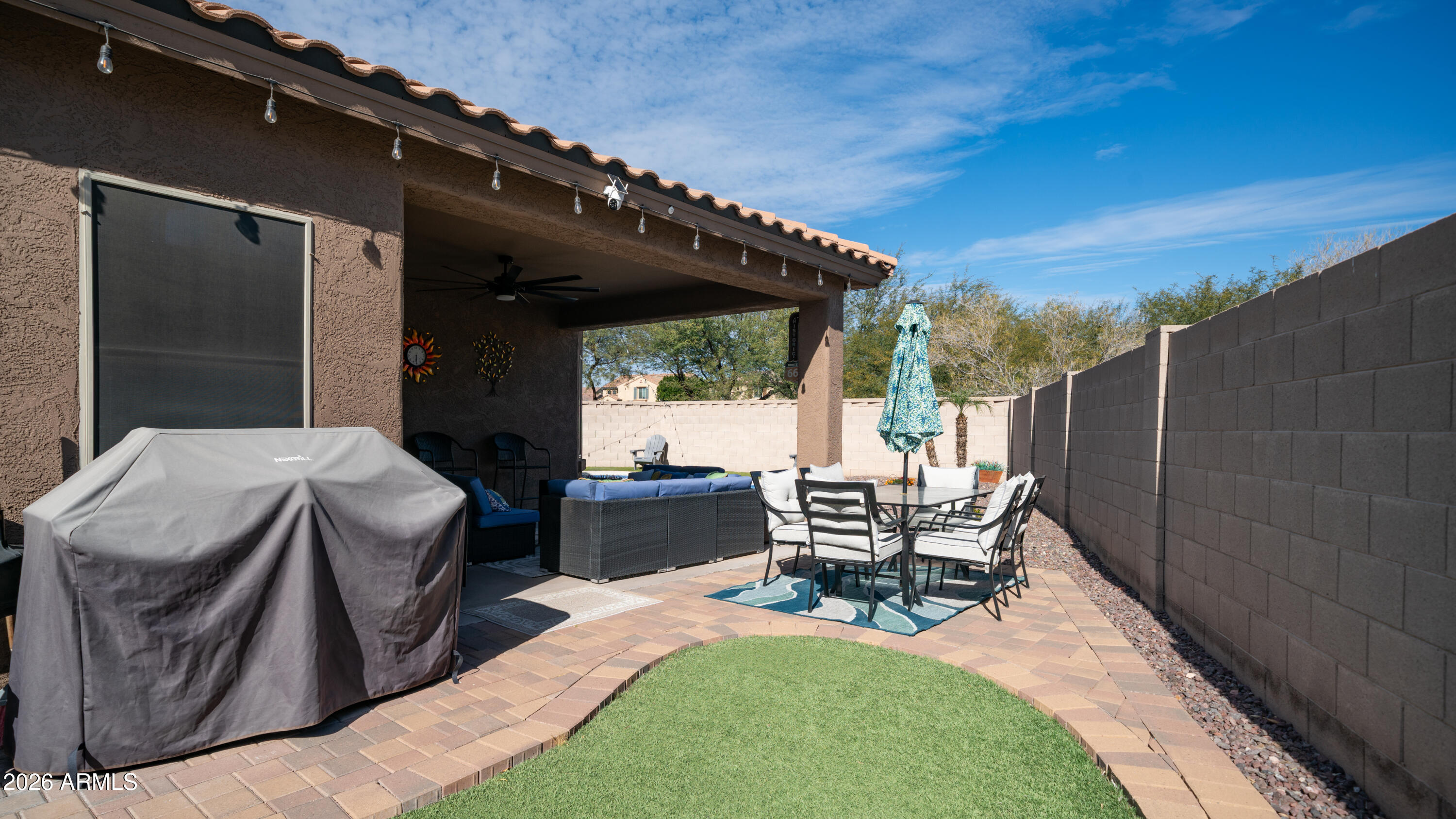 10754 West Yearling Road Peoria, AZ 85383 - Photo 30 of 35 a patio with table and chairs