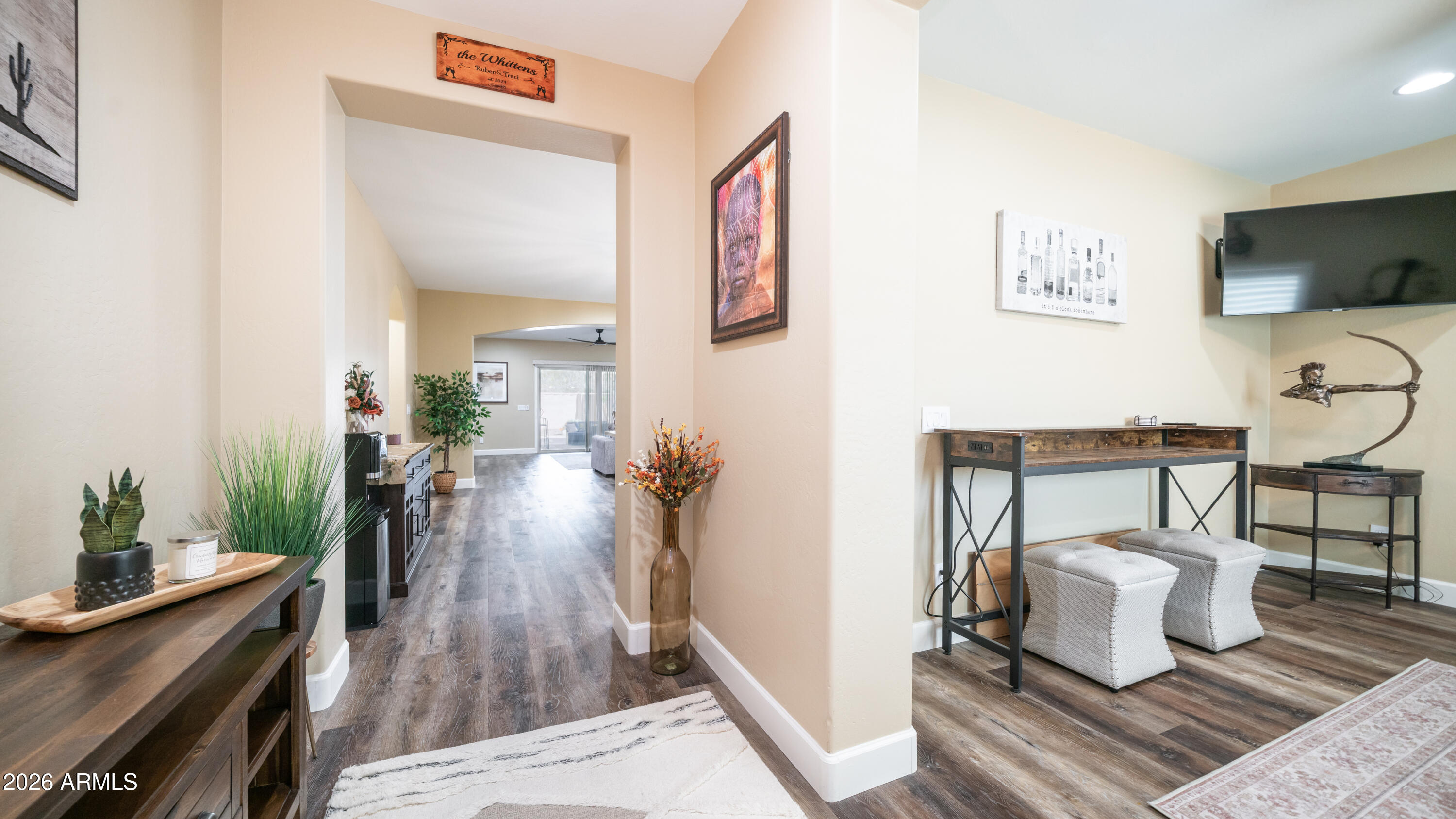 10754 West Yearling Road Peoria, AZ 85383 - Photo 3 of 35 a living room with furniture and a flat screen tv