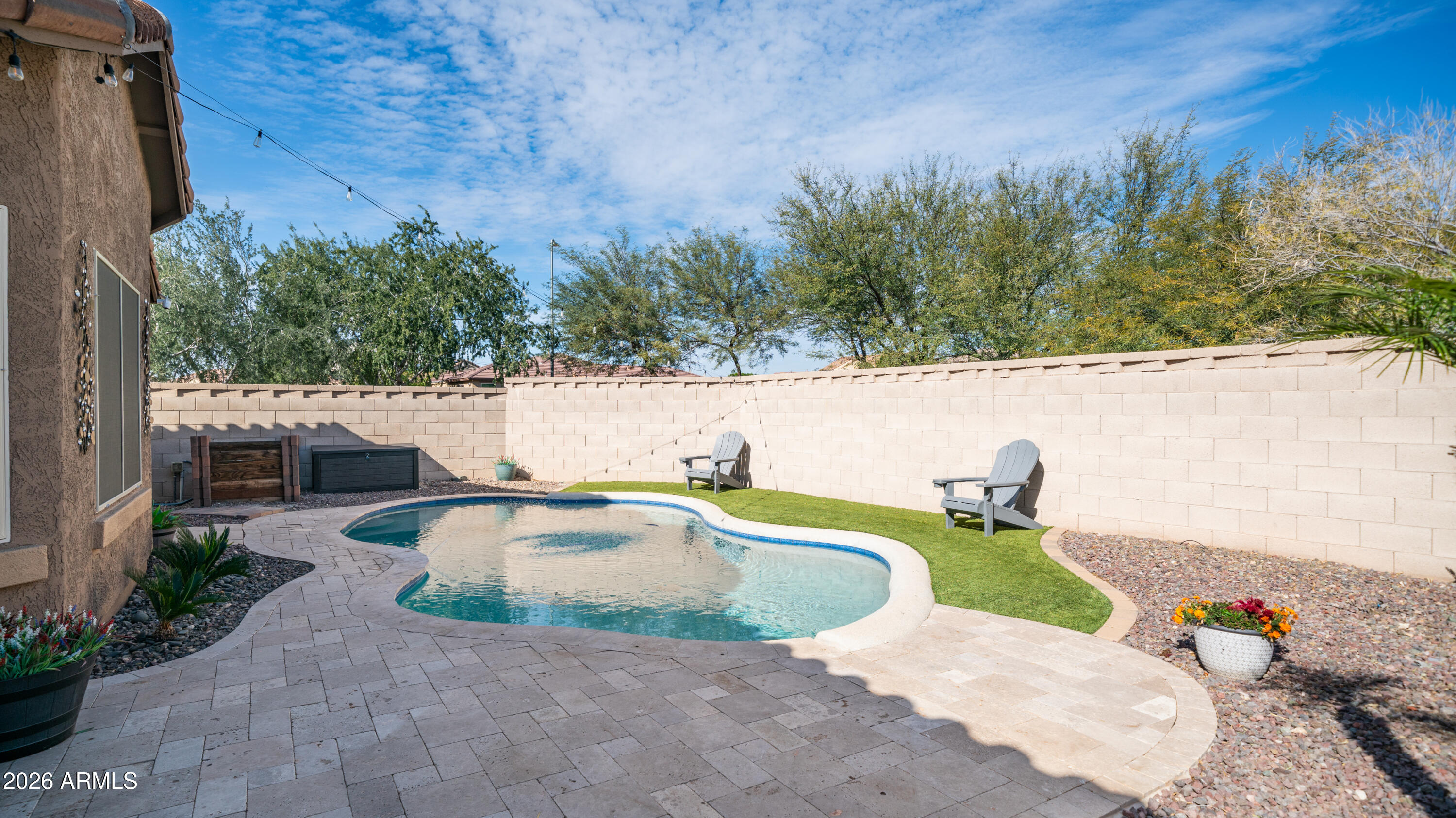 10754 West Yearling Road Peoria, AZ 85383 - Photo 31 of 35 a view of a swimming pool with a patio