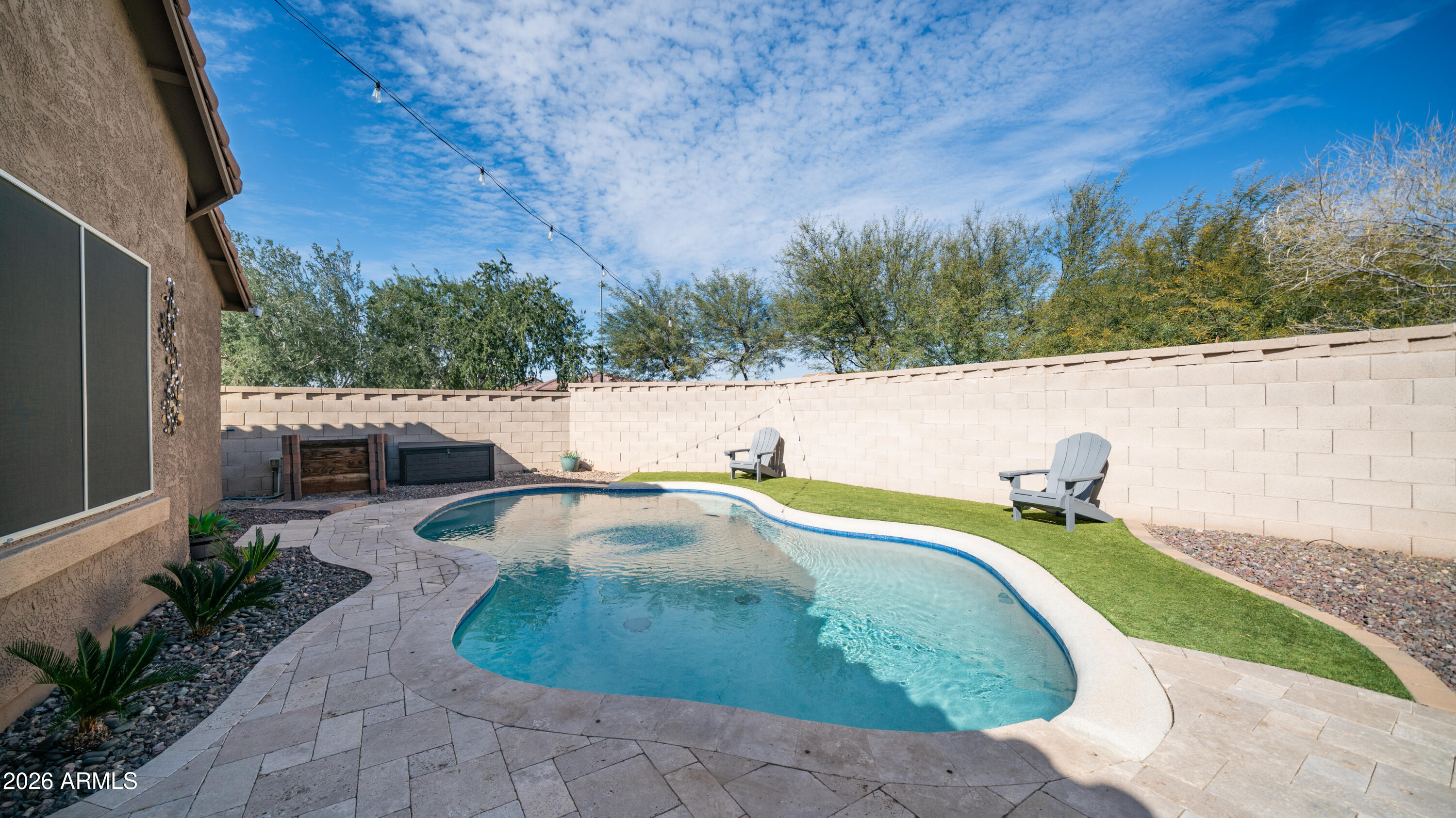 10754 West Yearling Road Peoria, AZ 85383 - Photo 32 of 35 a view of a swimming pool with a patio