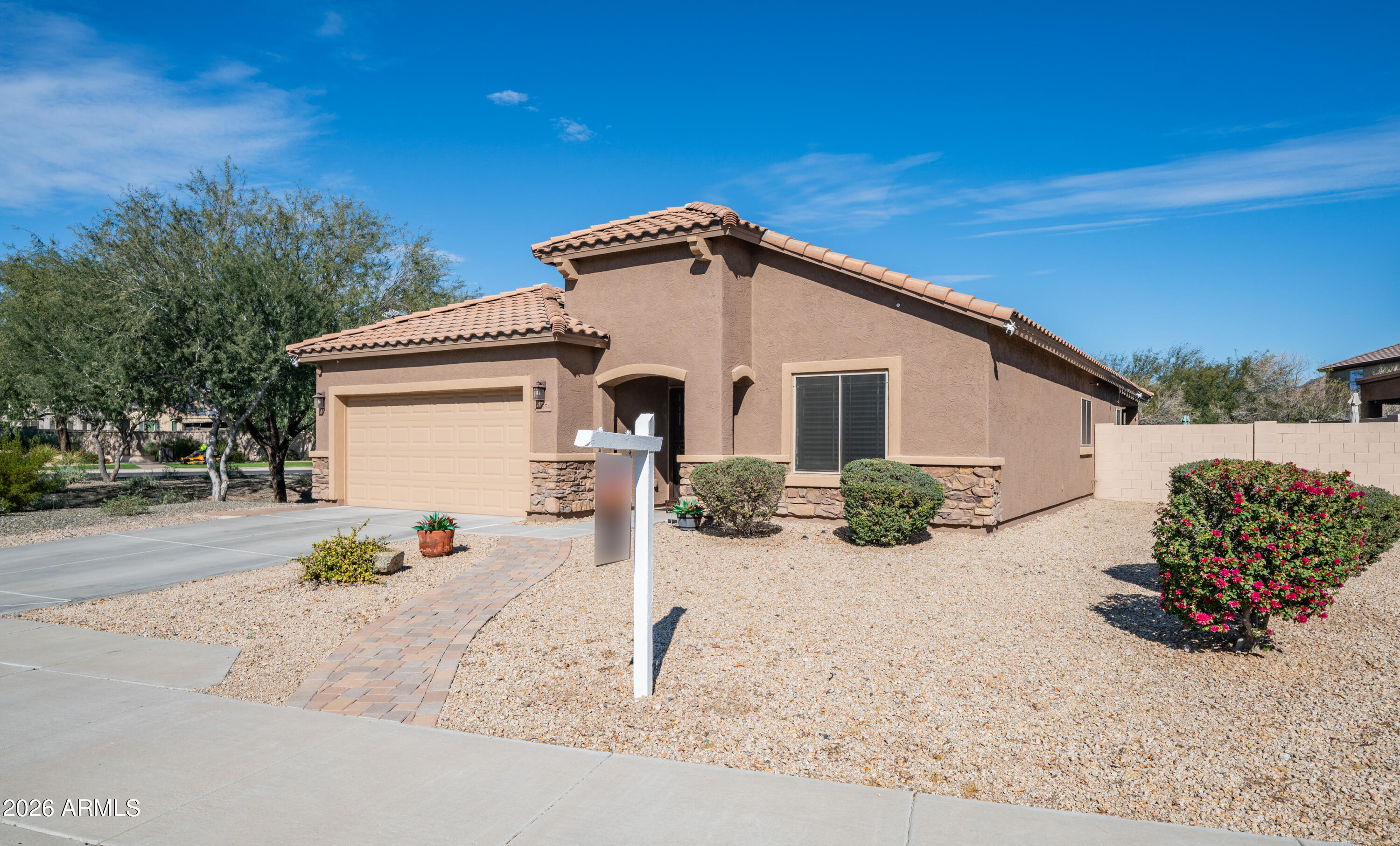 10754 West Yearling Road Peoria, AZ 85383 - Photo 34 of 35 a view of a house with a patio