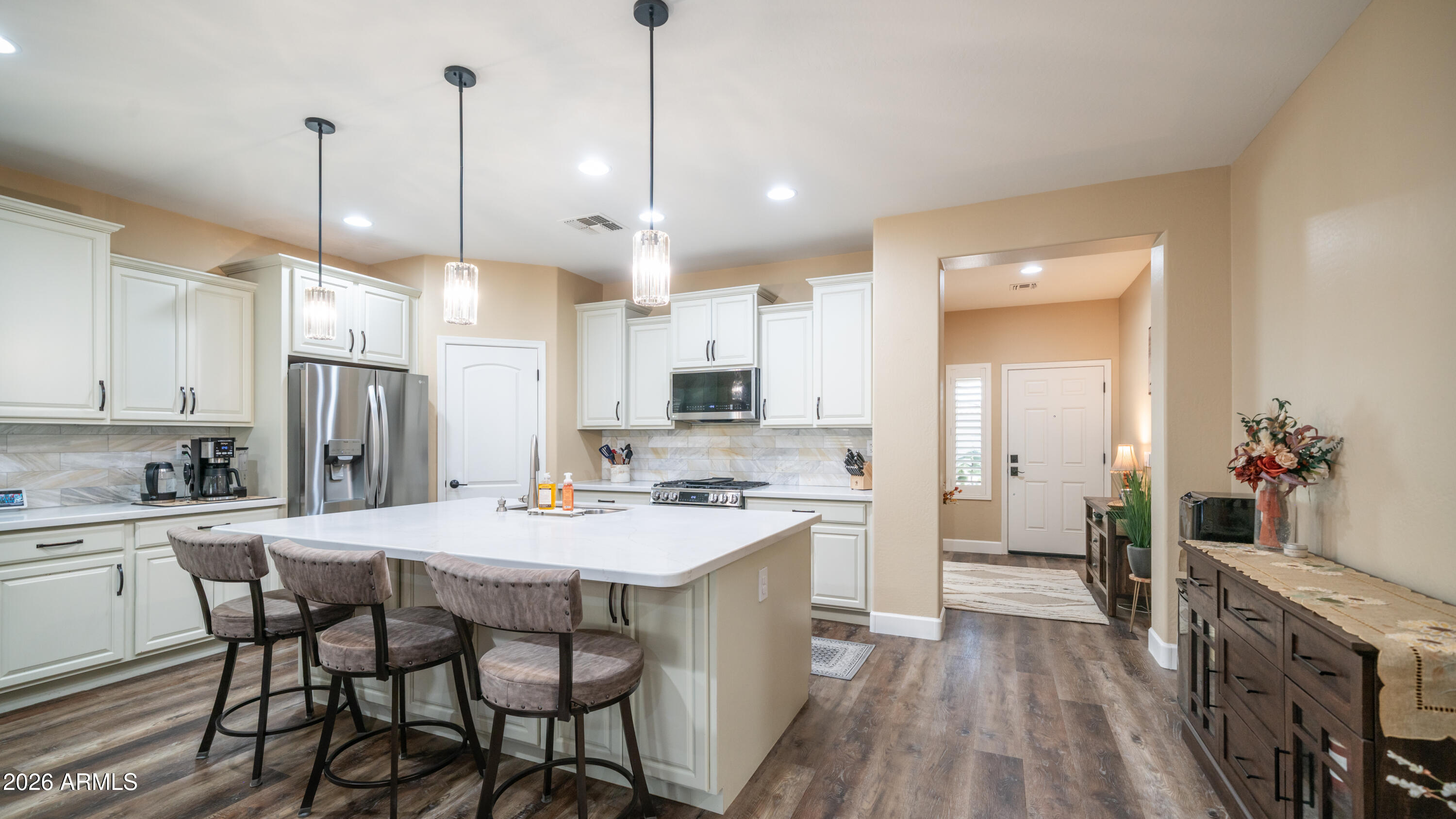 10754 West Yearling Road Peoria, AZ 85383 - Photo 9 of 35 a large kitchen with a table and chairs