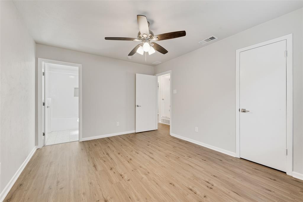 4010 Burning Tree Lane Garland, TX 75042 - Photo 13 of 20 a view of an empty room with wooden floor