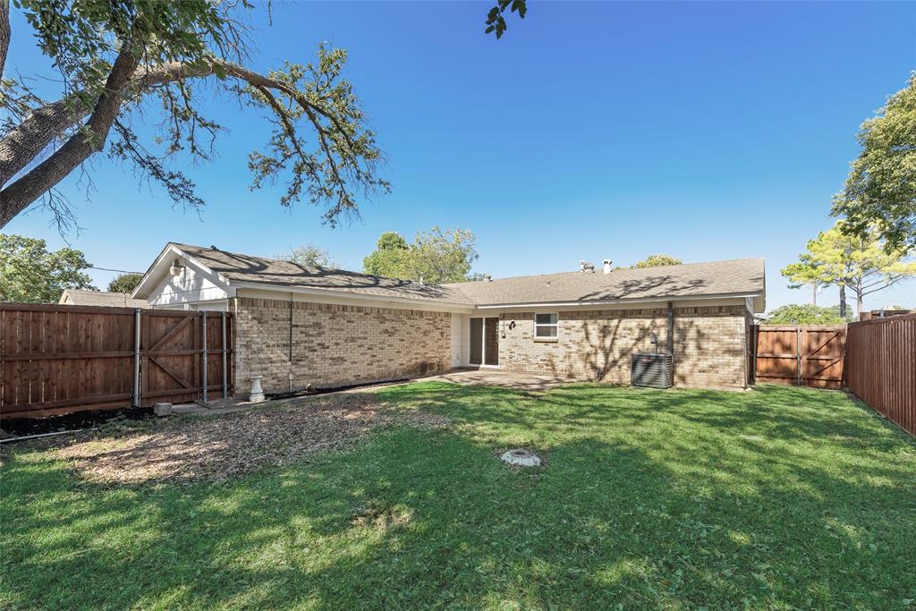 4010 Burning Tree Lane Garland, TX 75042 - Photo 20 of 20 a view of a backyard with a garden