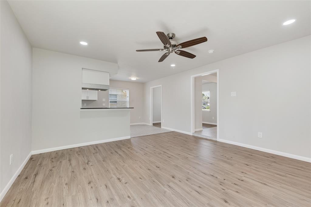 4010 Burning Tree Lane Garland, TX 75042 - Photo 6 of 20 wooden floor in an empty room with a window