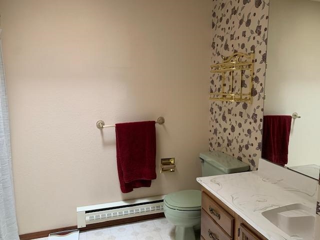570 Southwest 2nd Court Cedaredge, CO 81413 - Photo 10 of 32 a bathroom with a toilet and a sink