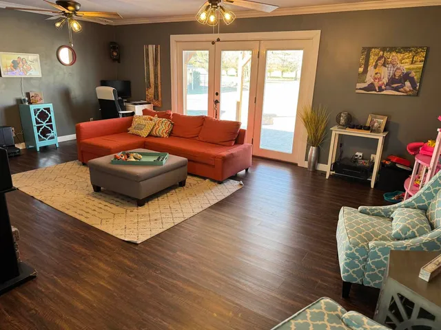 a bathroom with a granite countertop sink a toilet and a mirror