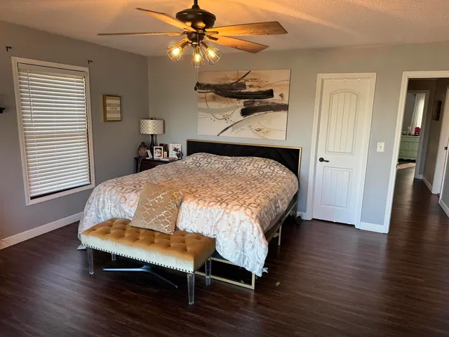 a bathroom with a black white checkered floor