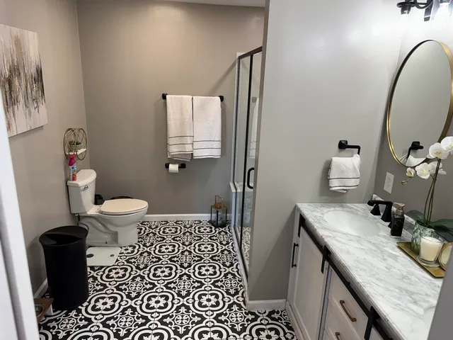 a bedroom with a bed and a dresser