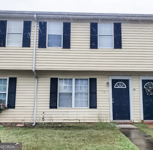 a front view of a white house