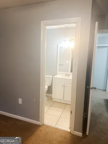 a bathroom with a sink a toilet and a shower