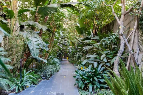 a view of a dining room with furniture and floor to ceiling window