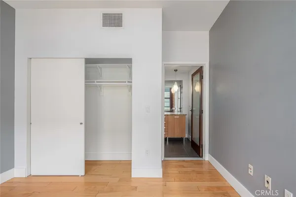 a view of a room that has a bed in it