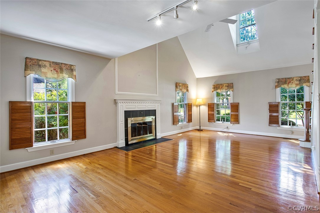 4019 Belspring Road Chester, VA 23831 - Photo 7 of 46 a view of empty room with wooden floor and fireplace