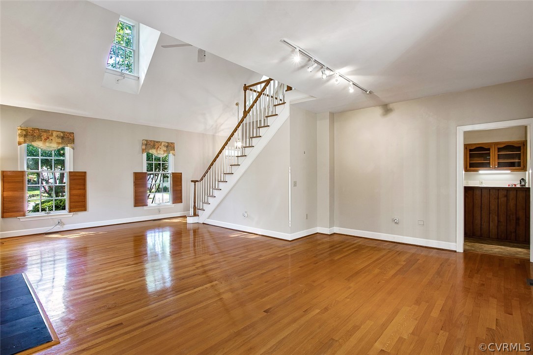 4019 Belspring Road Chester, VA 23831 - Photo 9 of 46 a view of an empty room with wooden floor and stairs