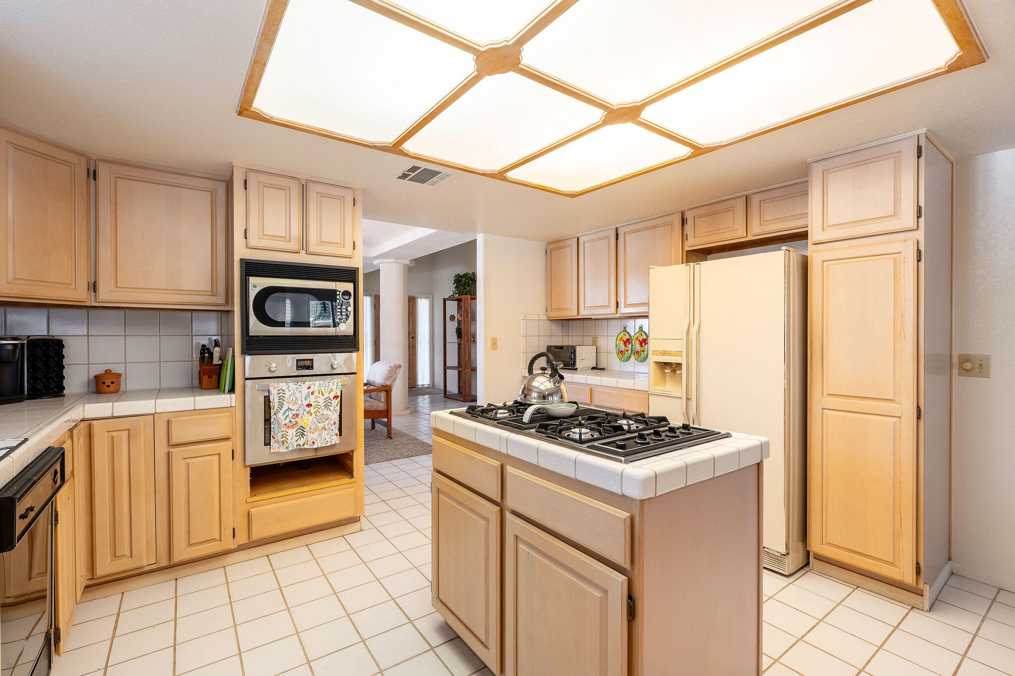 82151 Hanson Drive Indio, CA 92201 - Photo 9 of 38 a kitchen with stainless steel appliances granite countertop a refrigerator sink and stove