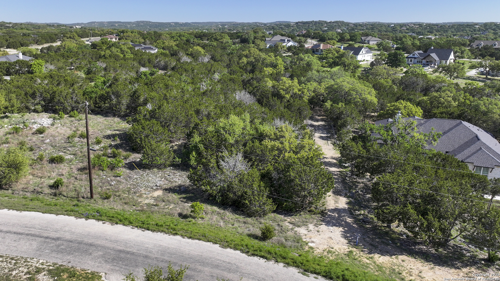 113 Alondra Lane Spring Branch, TX 78070 - Photo 12 of 25 a view of a yard with a tree