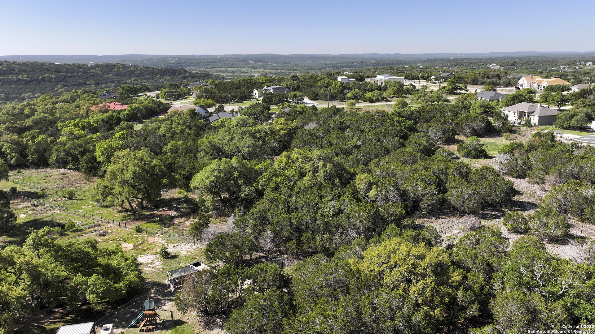 113 Alondra Lane Spring Branch, TX 78070 - Photo 21 of 25 an aerial view of residential houses with city view and lake view