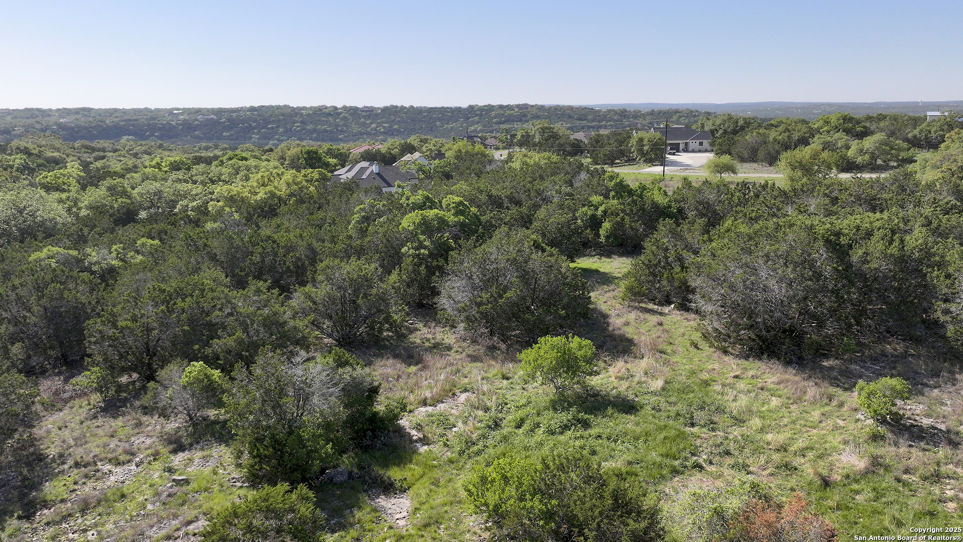 113 Alondra Lane Spring Branch, TX 78070 - Photo 22 of 25 a view of a green field with lots of bushes