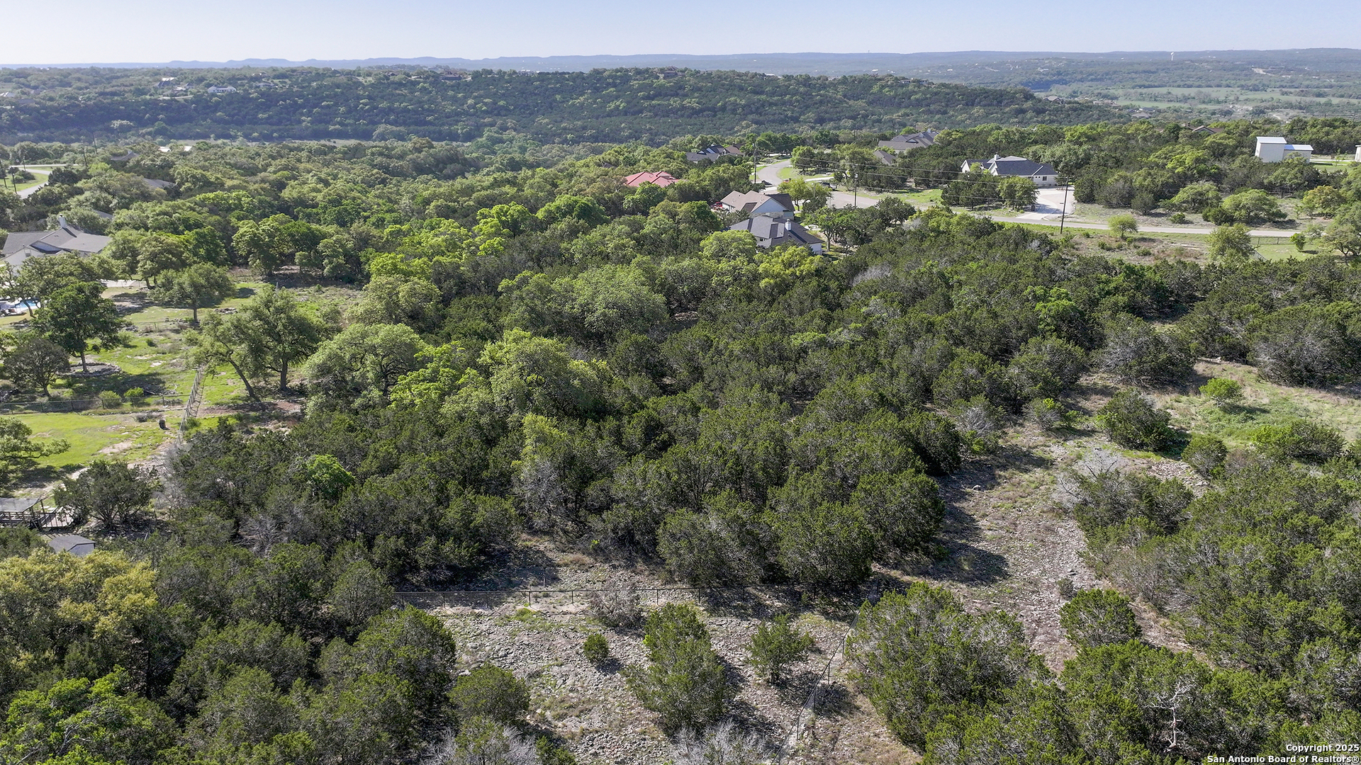 113 Alondra Lane Spring Branch, TX 78070 - Photo 23 of 25 a view of a forest with a street