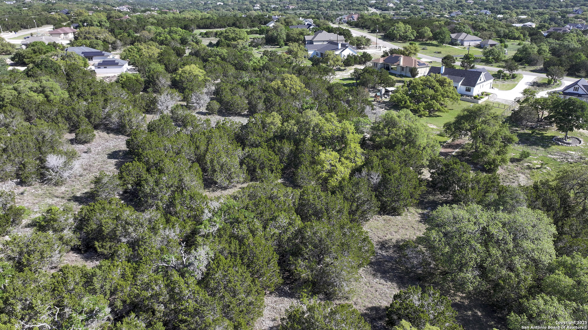 113 Alondra Lane Spring Branch, TX 78070 - Photo 24 of 25 an aerial view of residential house with outdoor space and trees