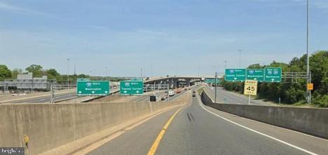 6809 Rolling Road Springfield, VA 22152 - Photo 41 of 50 Highway crossroads under clear skies.