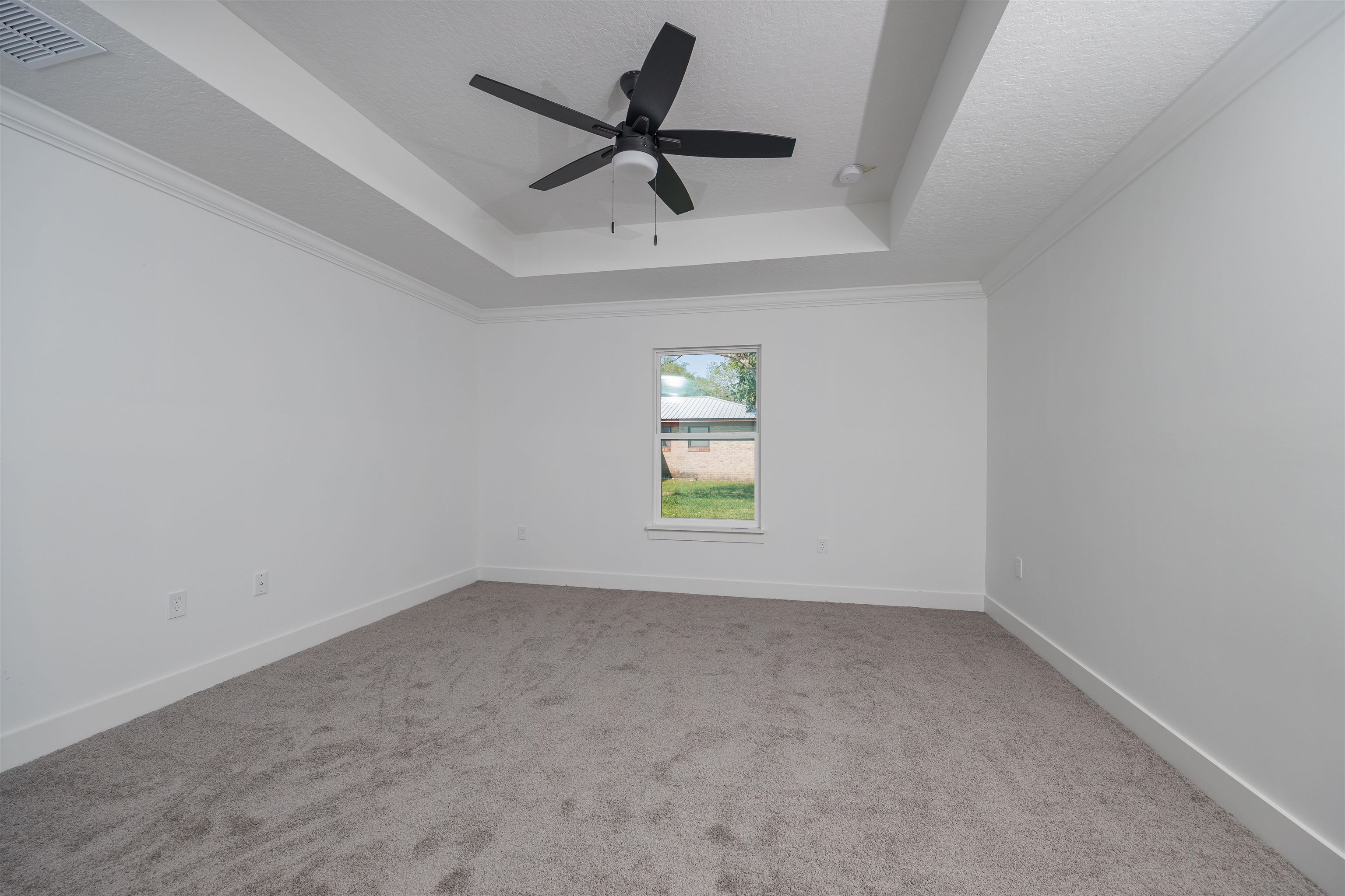 1130 Prince Road St. Augustine, FL 32086 - Photo 17 of 48 an empty room with a window and a ceiling fan