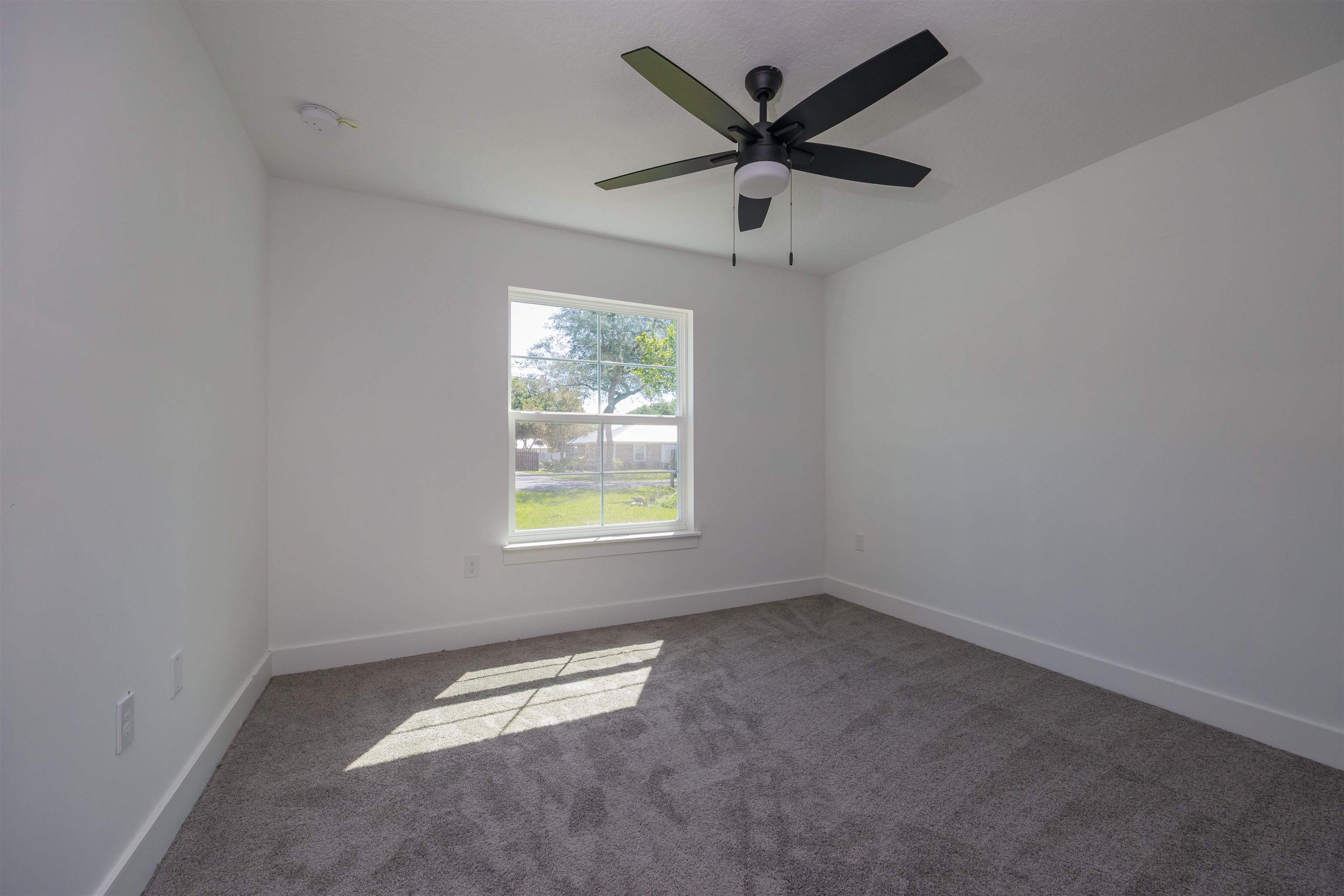 1130 Prince Road St. Augustine, FL 32086 - Photo 26 of 48 an empty room with a window and a fan