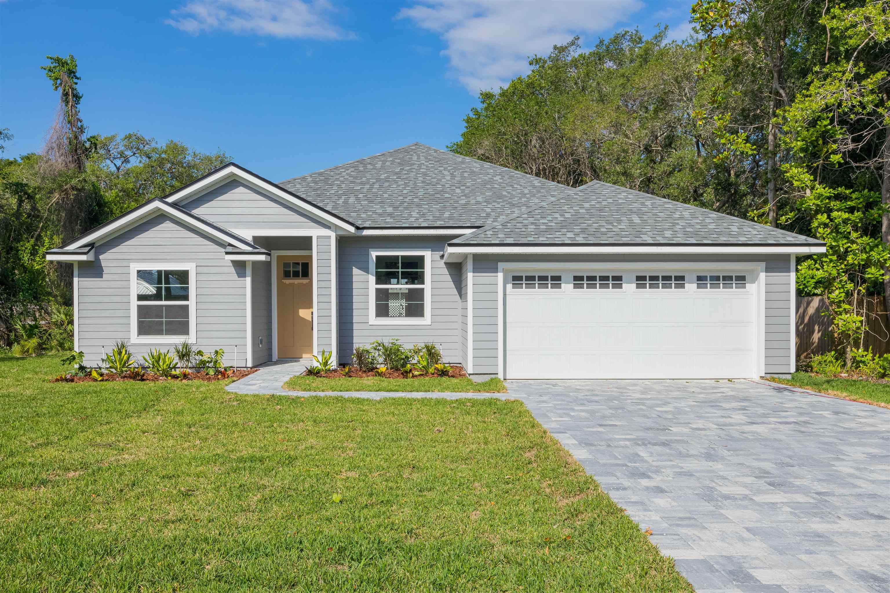 1130 Prince Road St. Augustine, FL 32086 - Photo 29 of 48 a front view of a house with a garden and yard