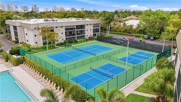a dining room with furniture and chandelier