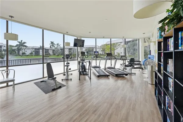a view of swimming pool with outdoor seating and a yard