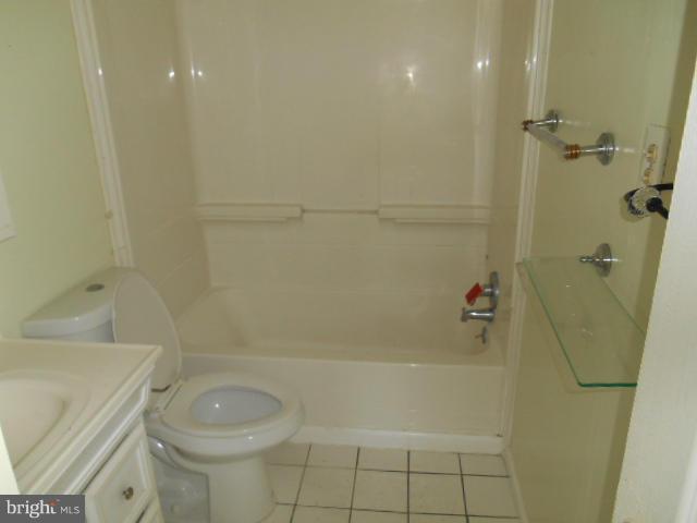 12718 Bushey Drive Silver Spring, MD 20906 - Photo 15 of 19 a bath room with a toilet and a bath tub
