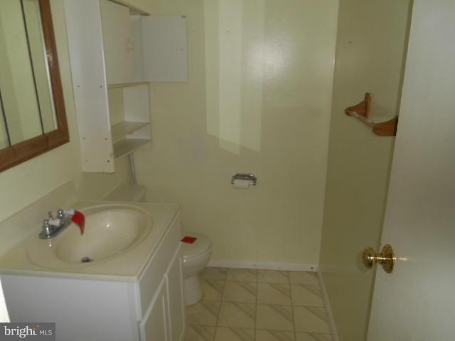 12718 Bushey Drive Silver Spring, MD 20906 - Photo 10 of 19 a bathroom with a sink and a shower