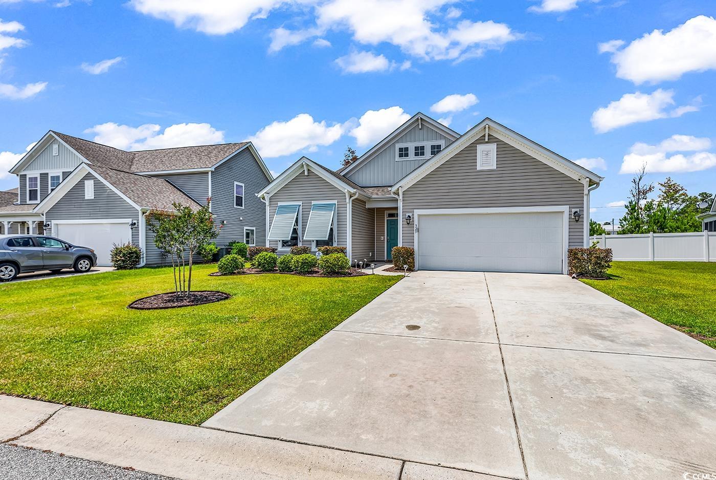 325 Cardita Loop Myrtle Beach, SC 29588 - Photo 1 of 39 View of front facade featuring board and batten si