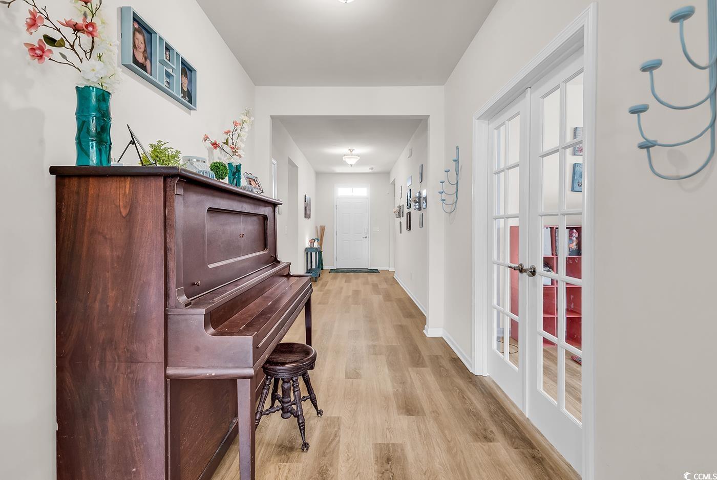 325 Cardita Loop Myrtle Beach, SC 29588 - Photo 17 of 39 Hallway featuring light wood-style floors and base