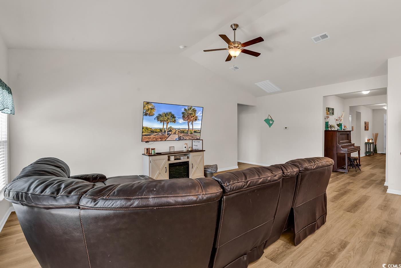 325 Cardita Loop Myrtle Beach, SC 29588 - Photo 23 of 39 Living room with ceiling fan, light wood finished