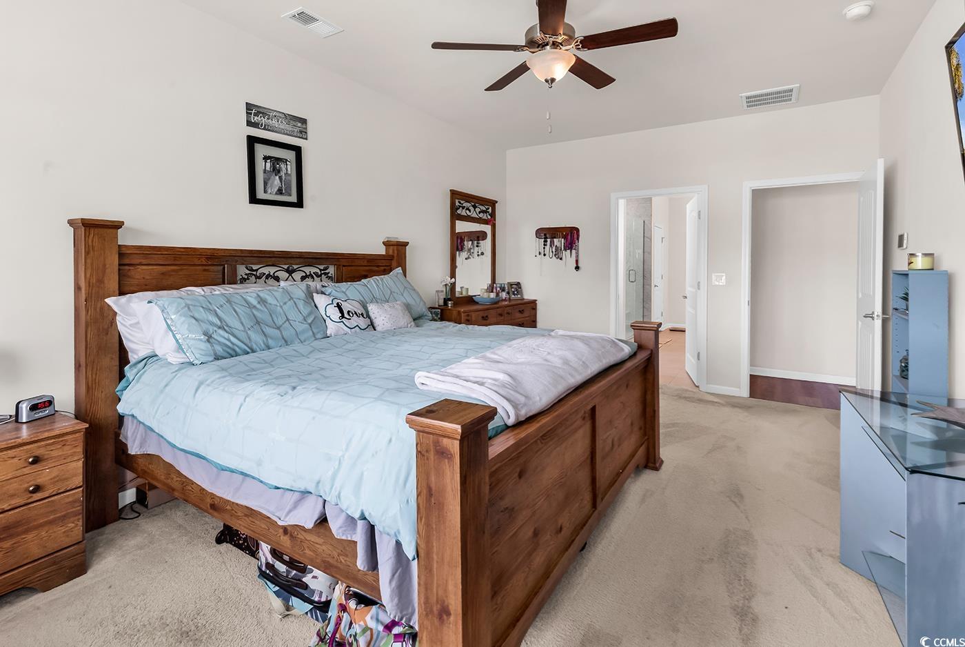 325 Cardita Loop Myrtle Beach, SC 29588 - Photo 25 of 39 Bedroom with light colored carpet and a ceiling fa