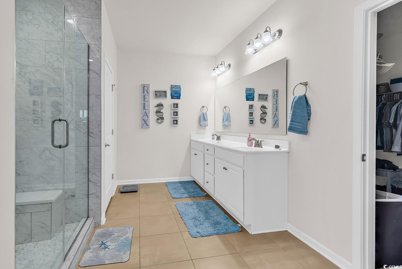 325 Cardita Loop Myrtle Beach, SC 29588 - Photo 27 of 39 Bathroom featuring double vanity, a spacious close