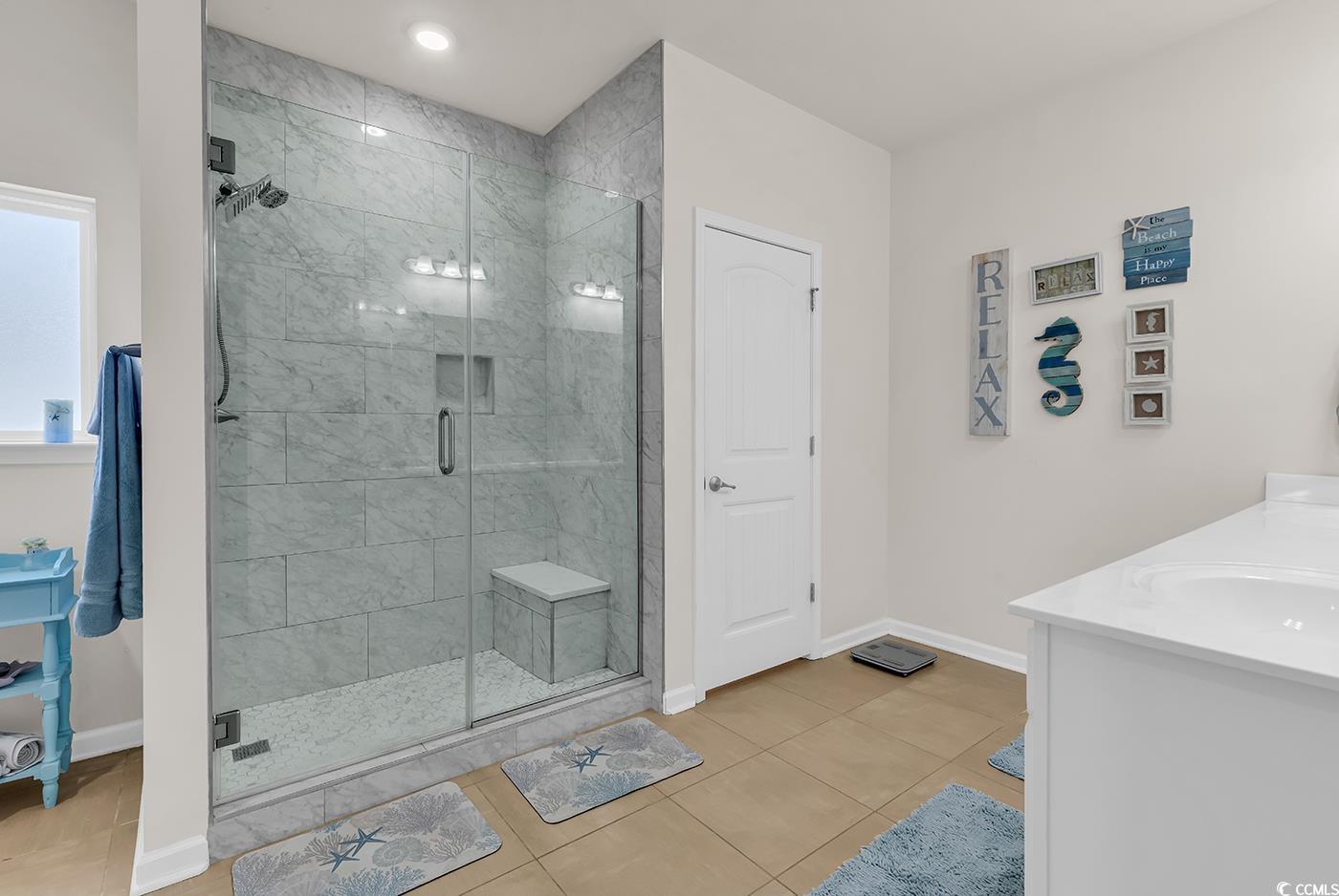 325 Cardita Loop Myrtle Beach, SC 29588 - Photo 28 of 39 Bathroom featuring a stall shower, vanity, recesse