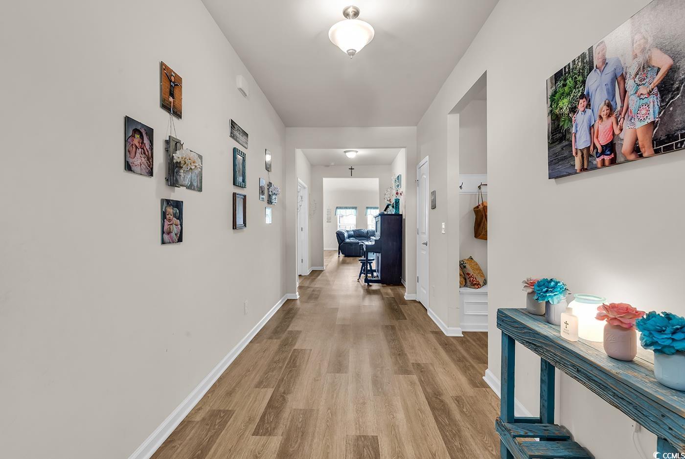 325 Cardita Loop Myrtle Beach, SC 29588 - Photo 3 of 39 Hall with light wood-style floors and baseboards