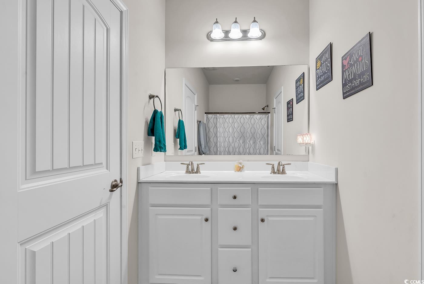 325 Cardita Loop Myrtle Beach, SC 29588 - Photo 7 of 39 Full bath featuring double vanity and a shower wit